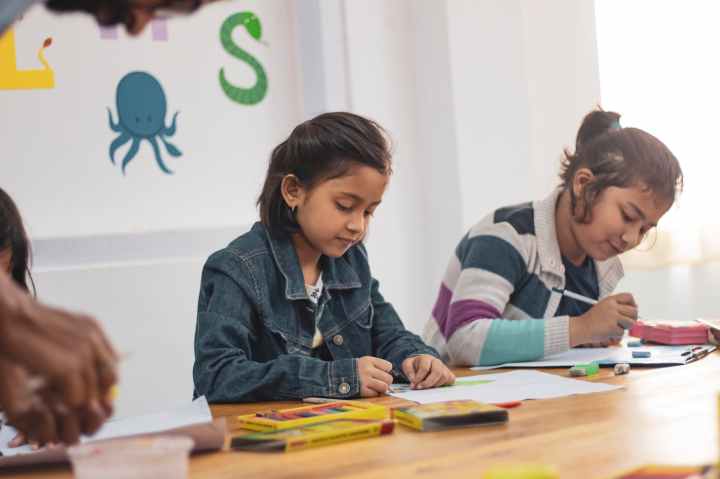 two girls doing school works